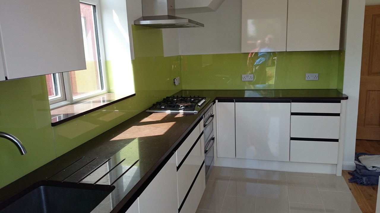 Lime green glass kitchen splashback installed by Clapton glaziers