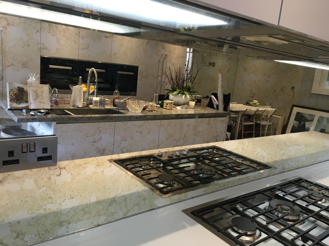 Mirror glass splashback in Clapton luxury kitchen